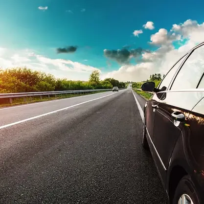 Private car on an open road for a long-distance transfer
